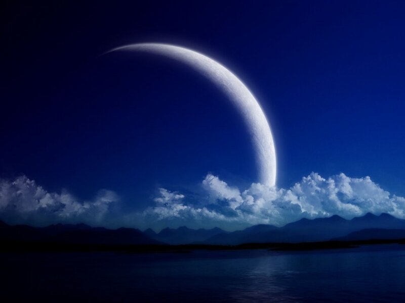 Moonrise over a tranquil lake