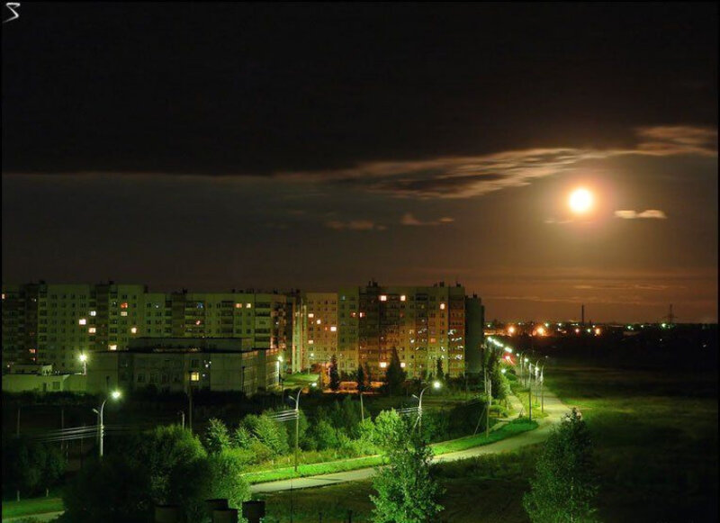 Moonrise over apartment buildings