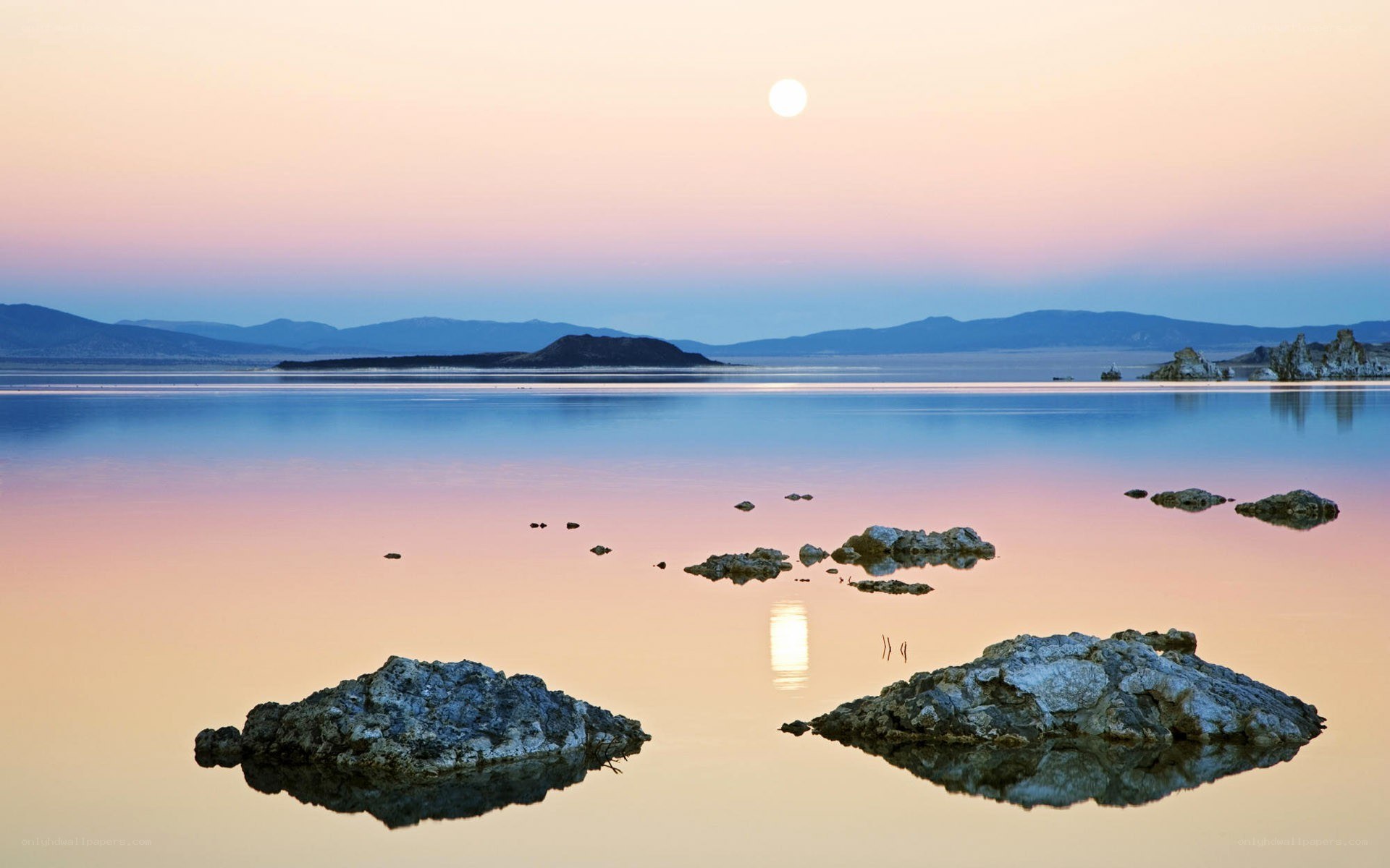Moonrise over calm lake