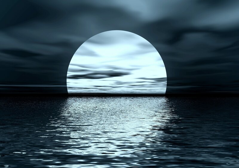 Moonrise over calm sea
