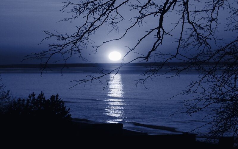 Moonrise over calm waters