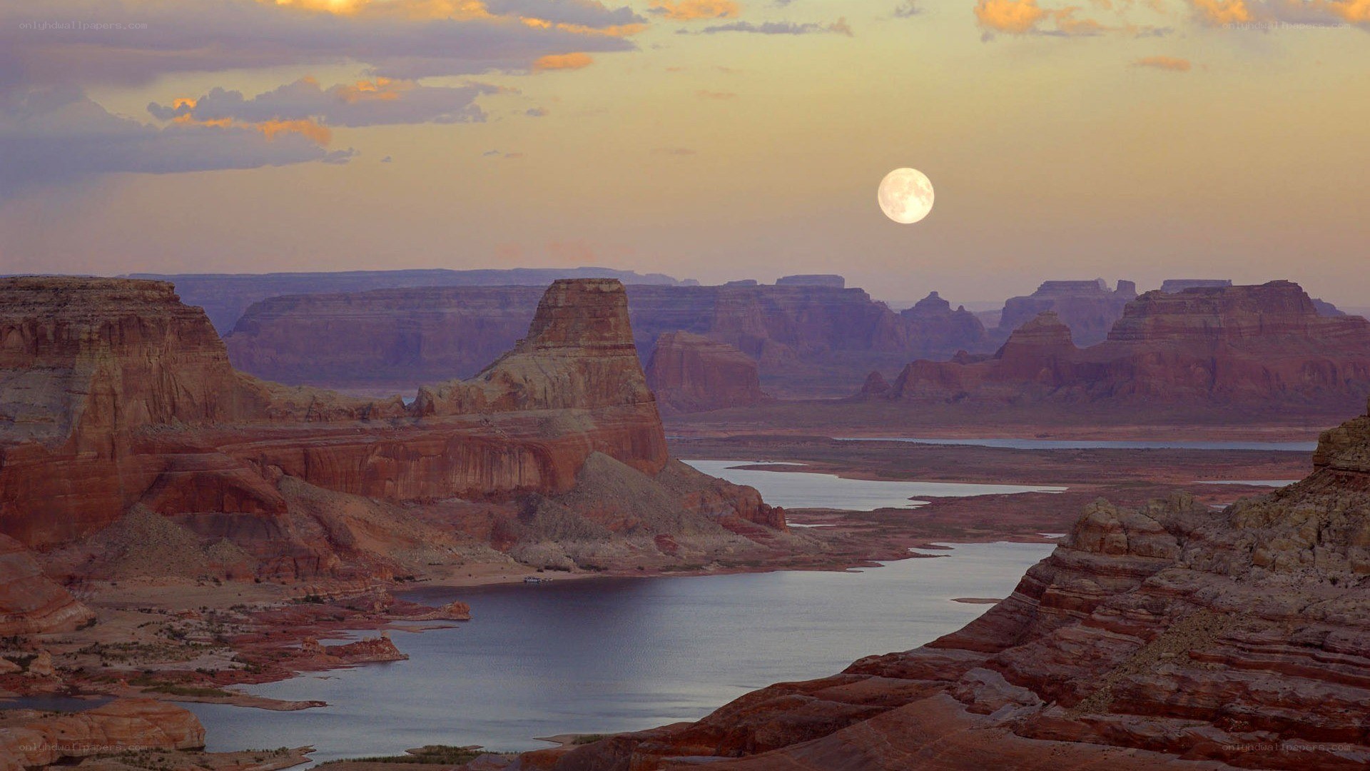 Moonrise over canyon landscape
