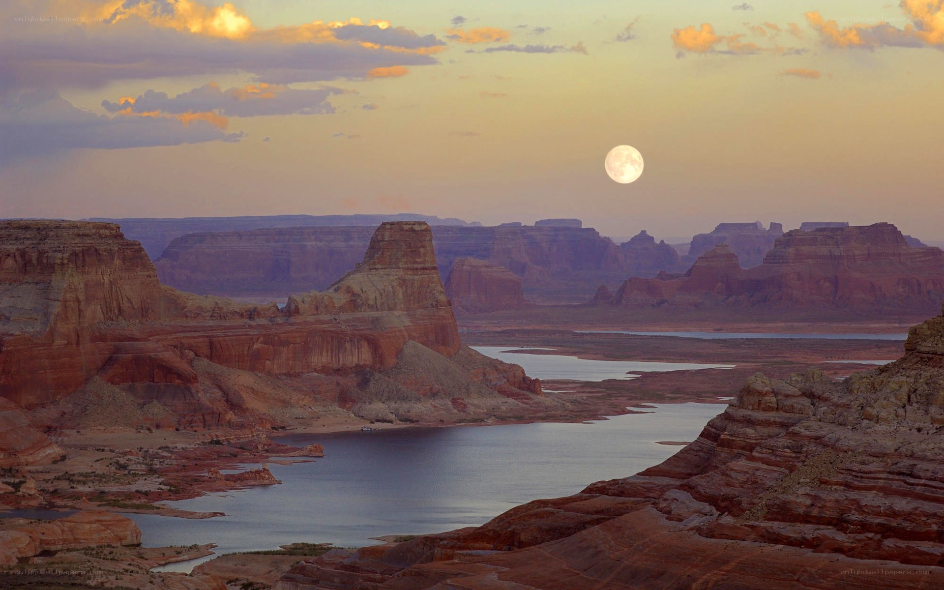Moonrise over canyon landscape