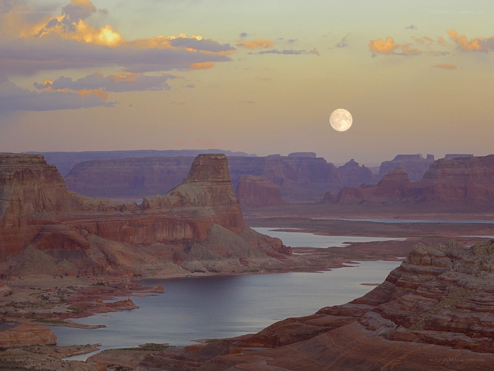 Moonrise over canyon landscape