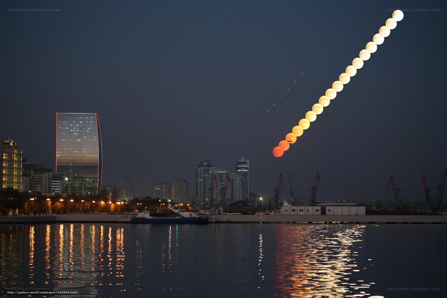 Moonrise over city skyline