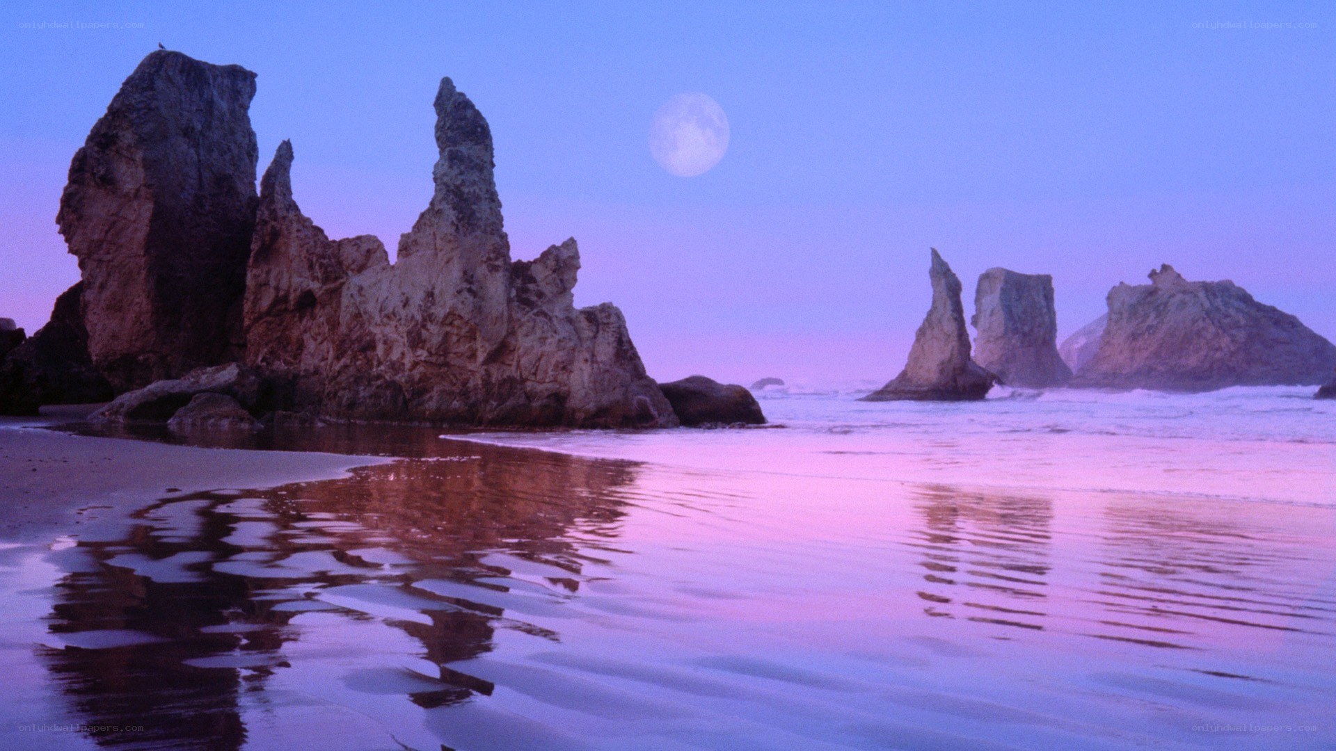 Moonrise over coastal rocks