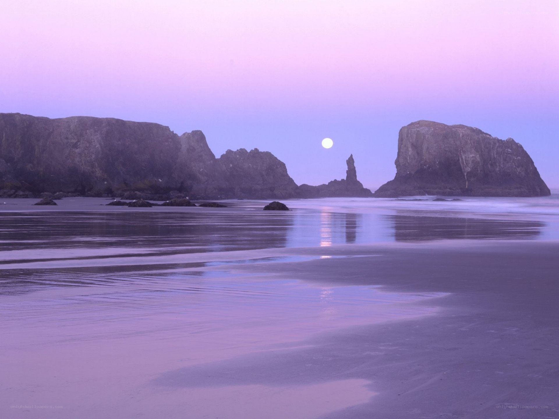 Moonrise over coastal rocks