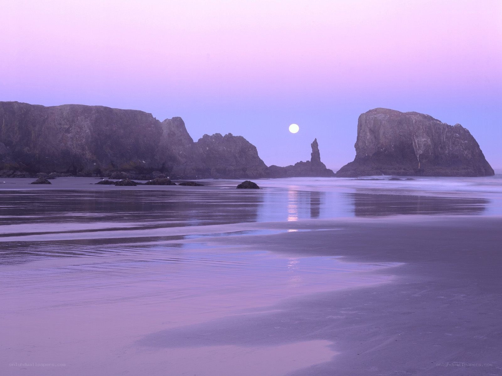 Moonrise over coastal rocks