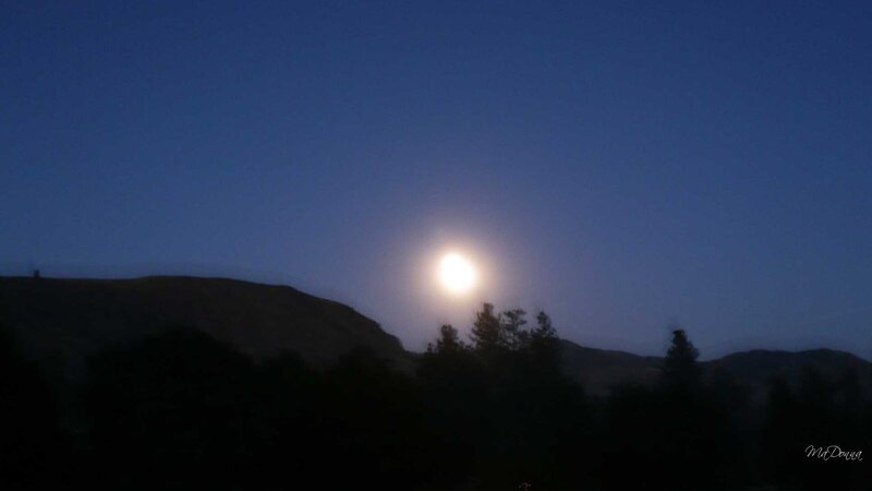 Moonrise over hills