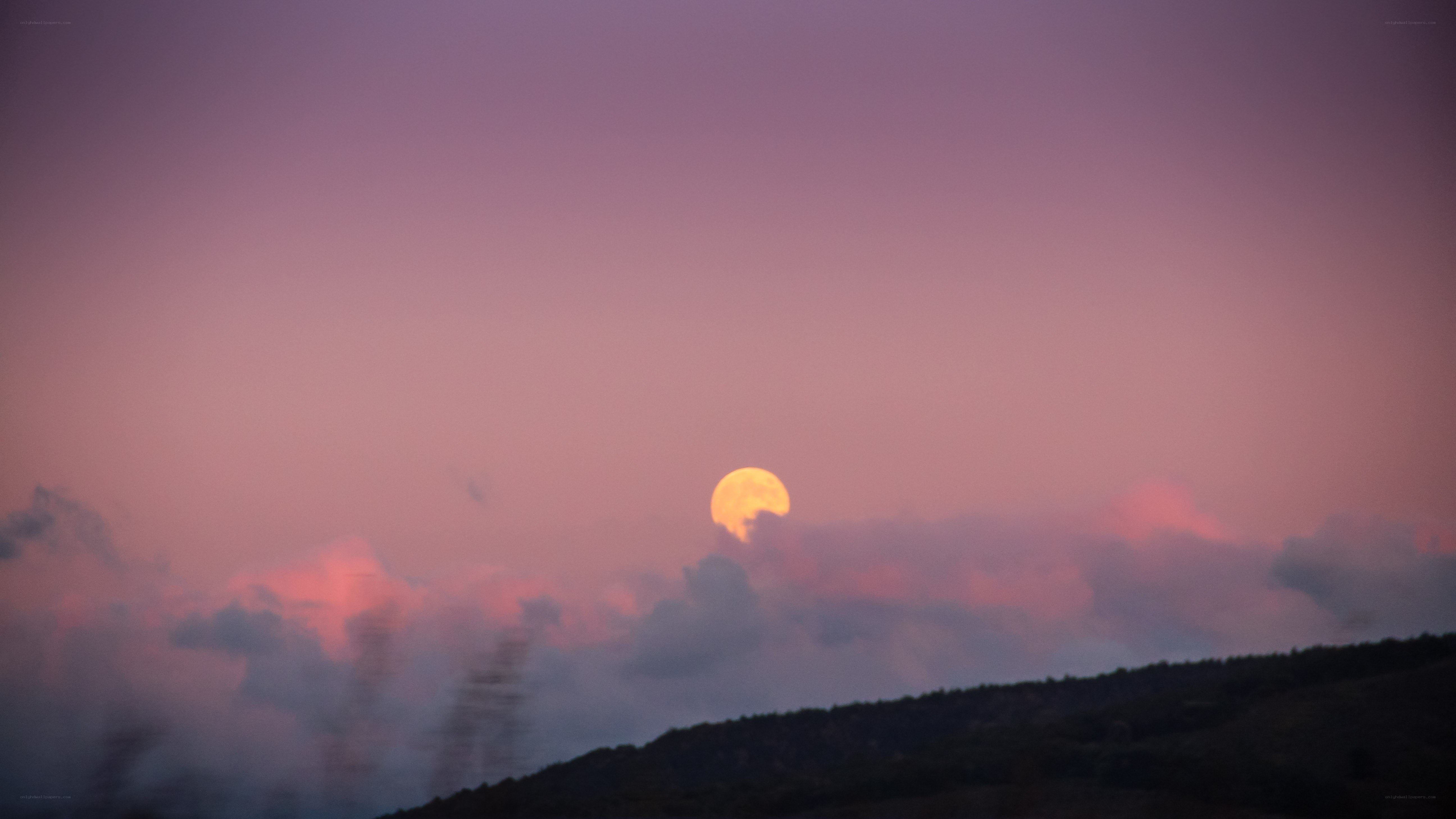 Moonrise over hills