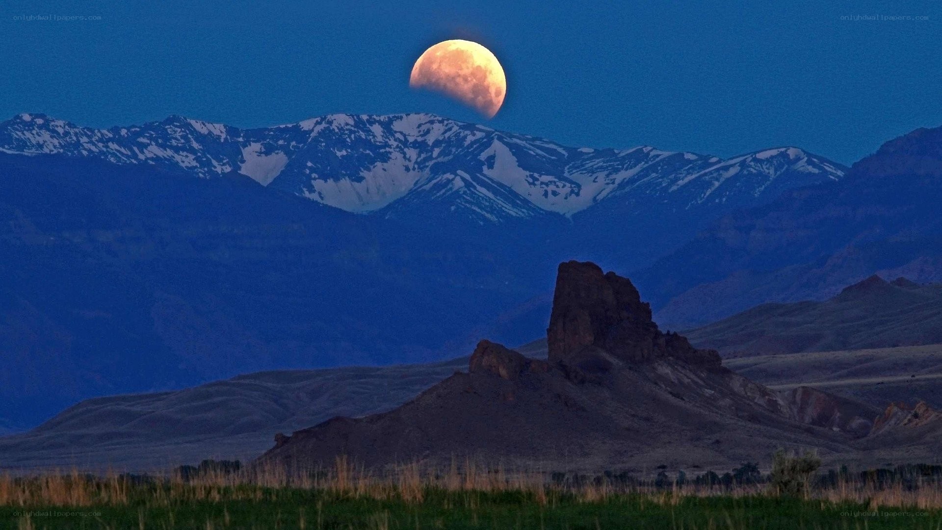 Moonrise over mountain landscape