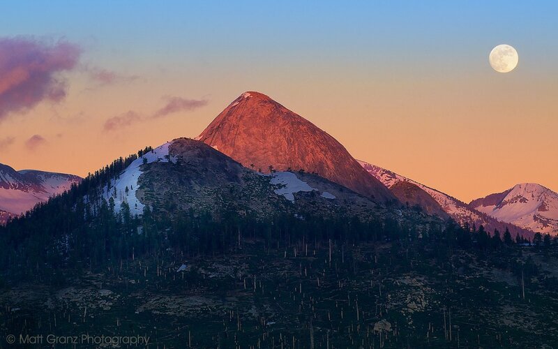 Moonrise over mountain peak