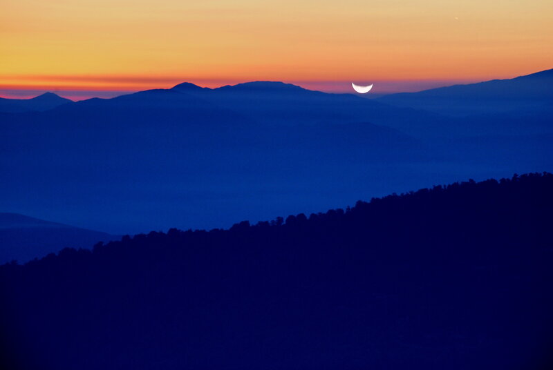 Moonrise over mountain ridges