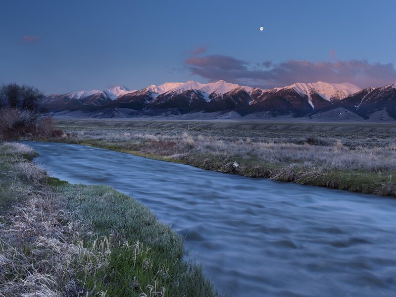Moonrise over mountain river