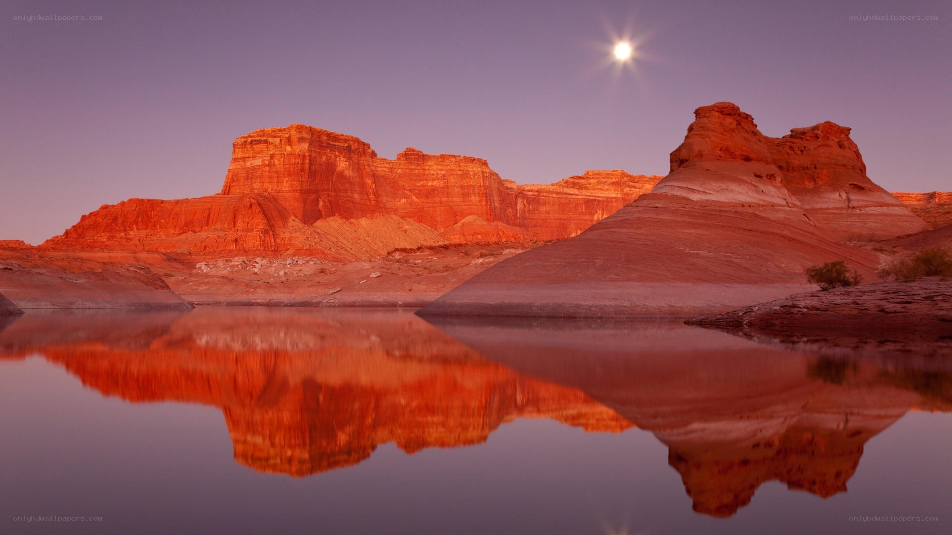 Moonrise over red rock canyon