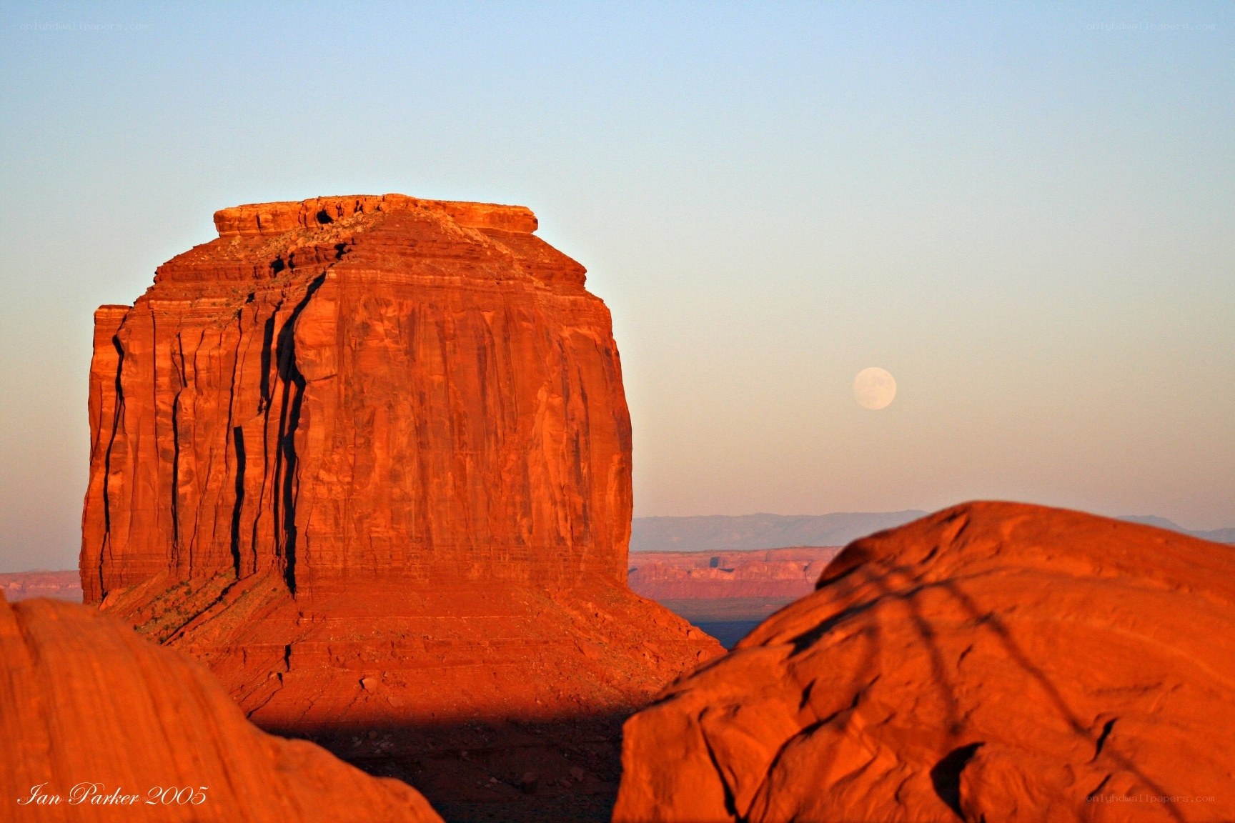 Moonrise over red rock formation
