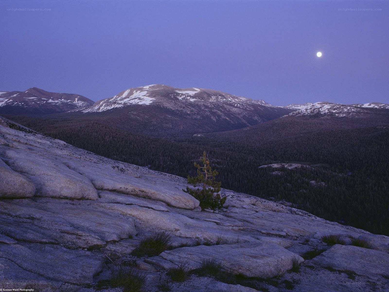 Moonrise over snowy mountains