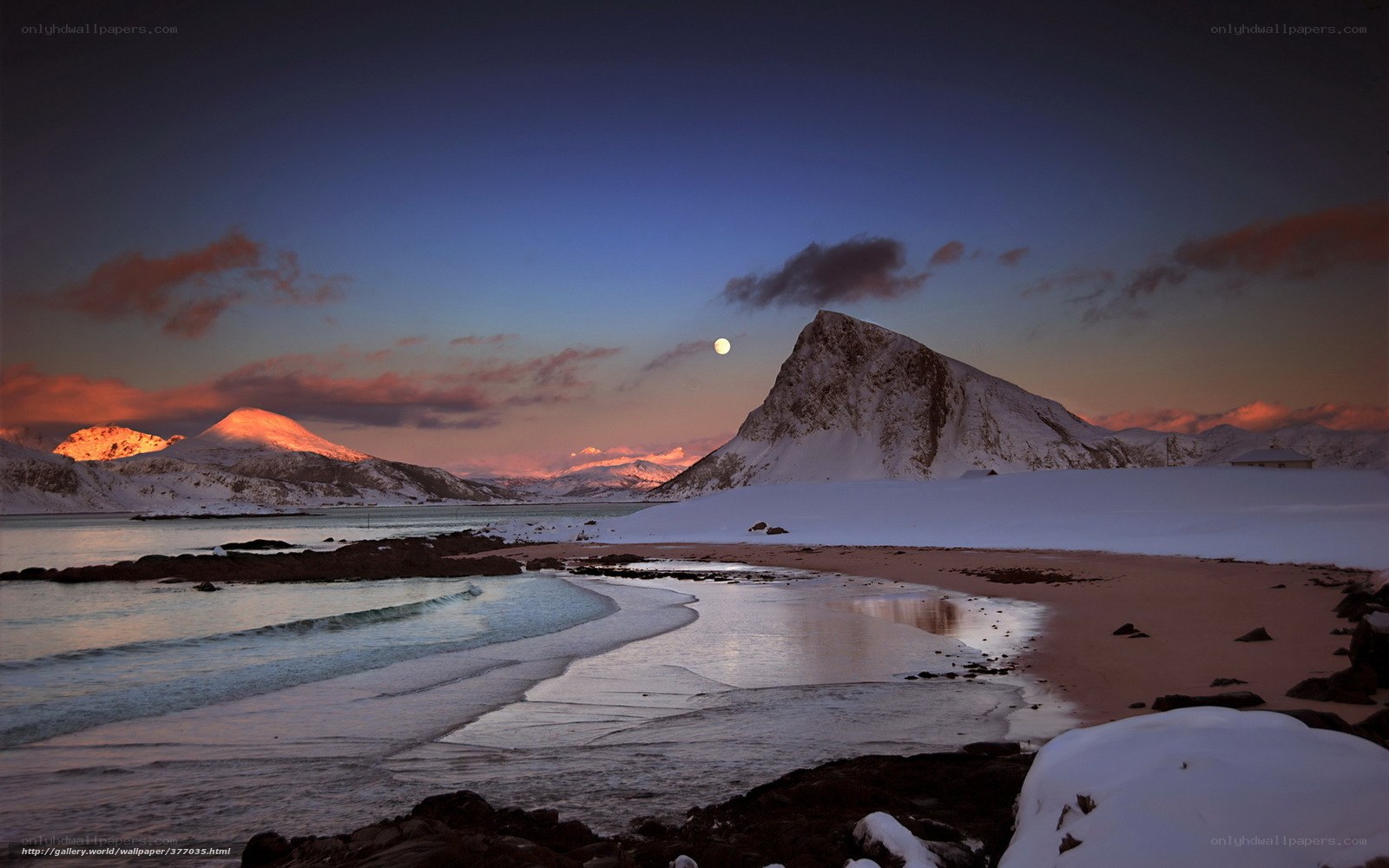 Moonrise over snowy mountains