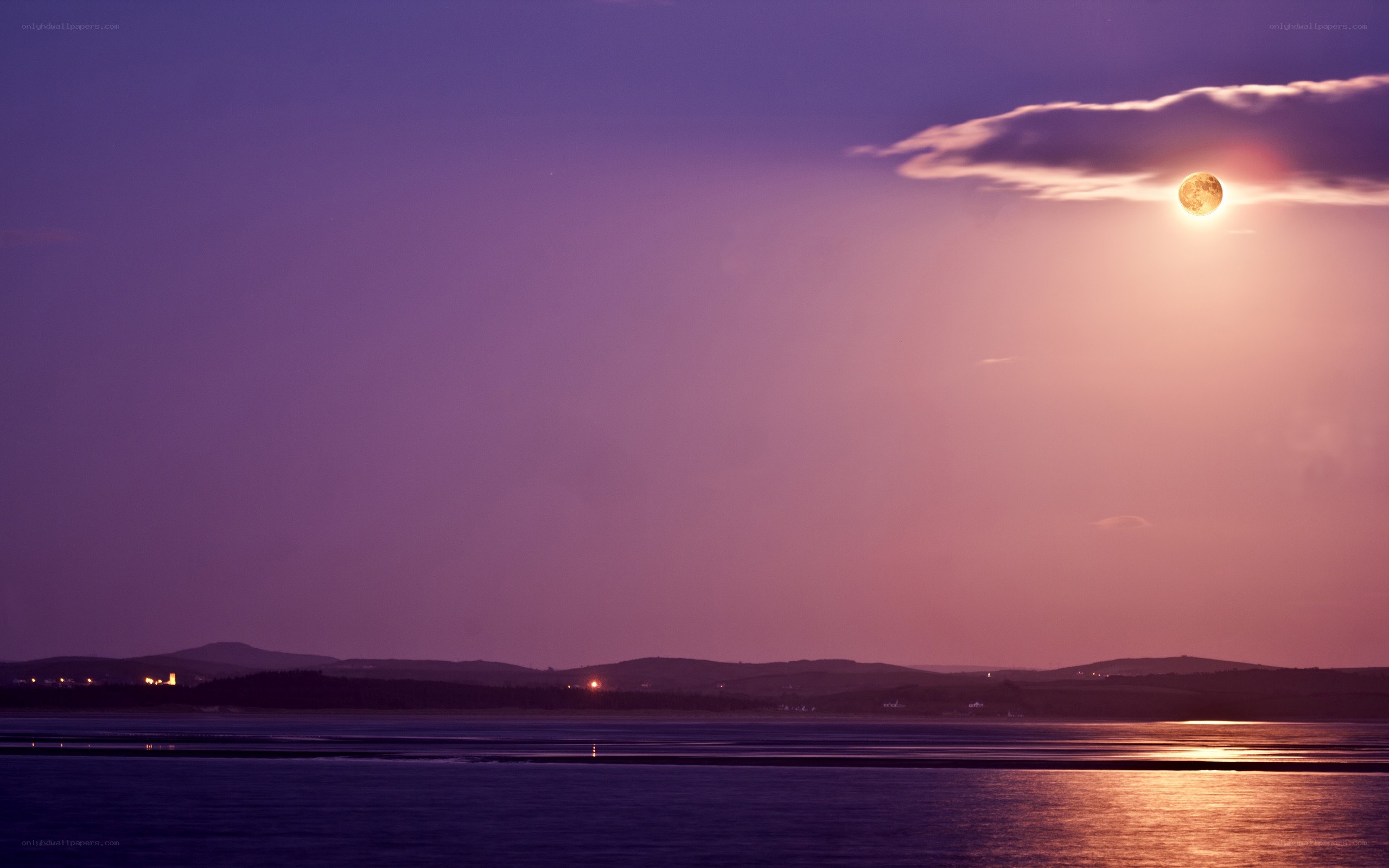 Moonrise over the water