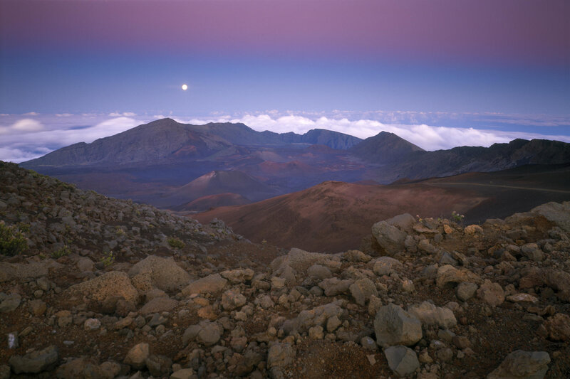 Moonrise over volcanic landscape