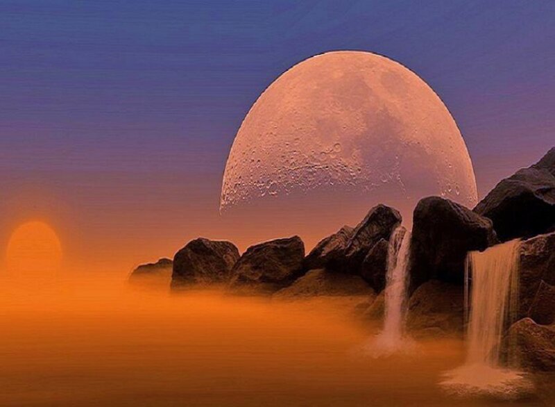 Moonrise over waterfall landscape