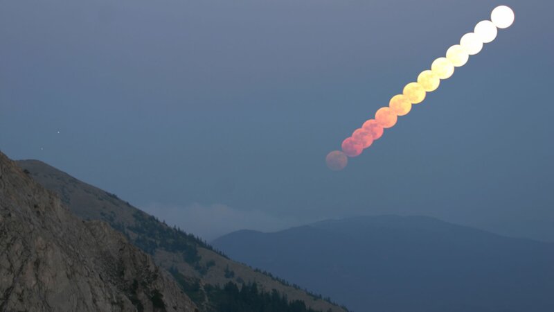 Moonrise time-lapse over mountains