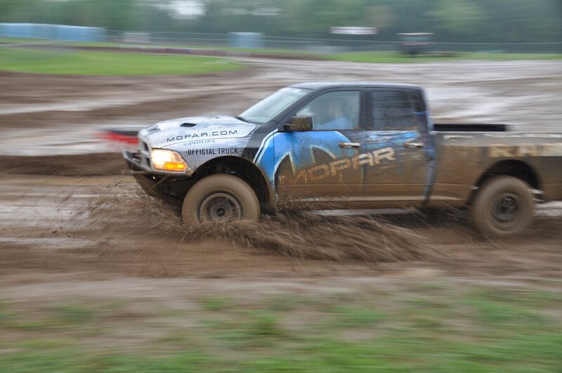 Mopar truck racing in mud
