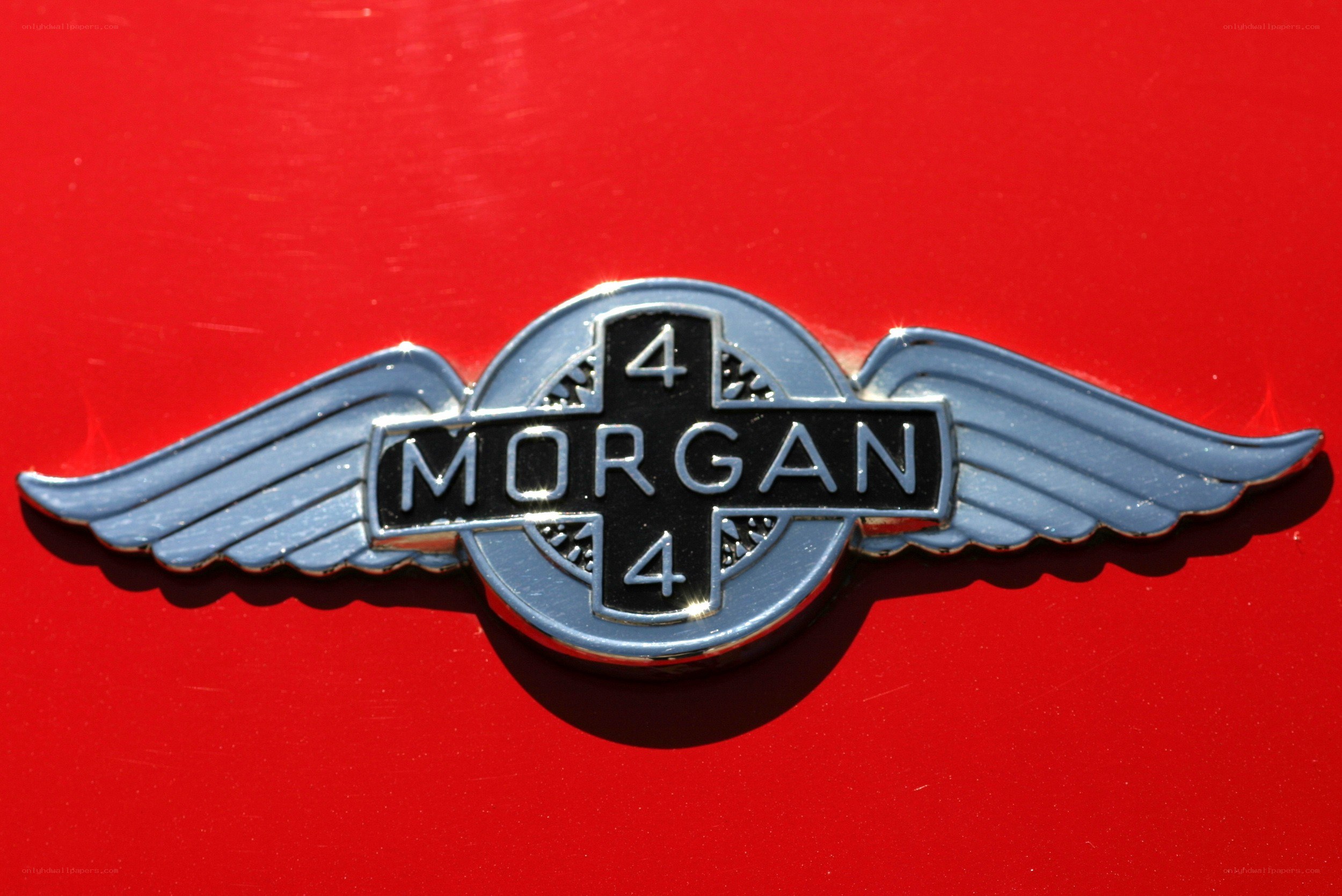 Morgan 4 emblem on red car