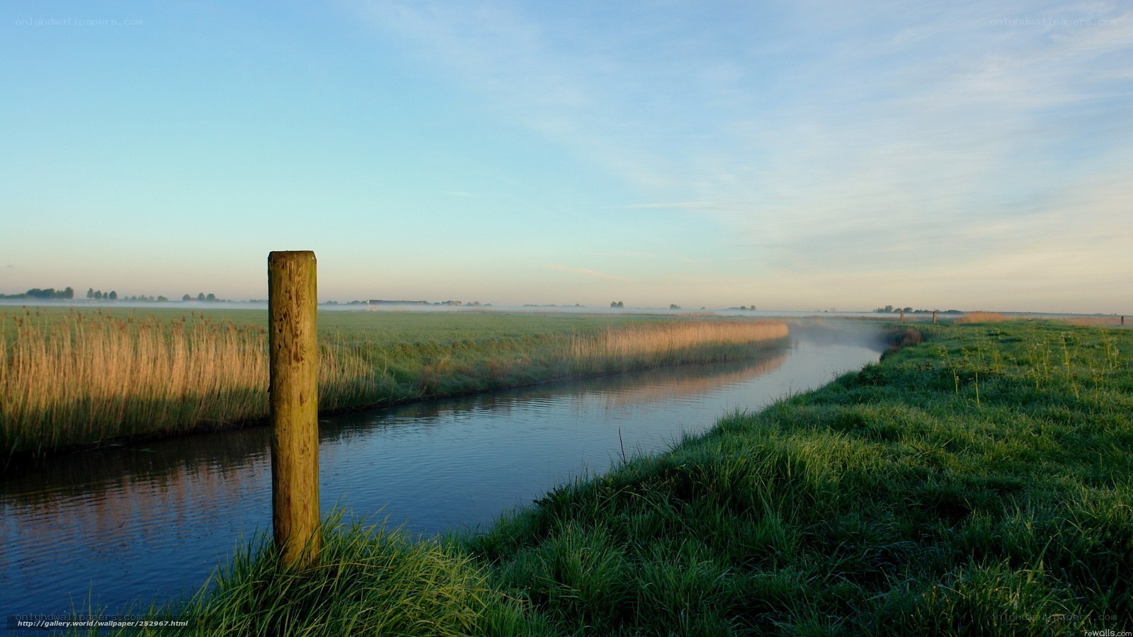Morning mist over a Dutch canal