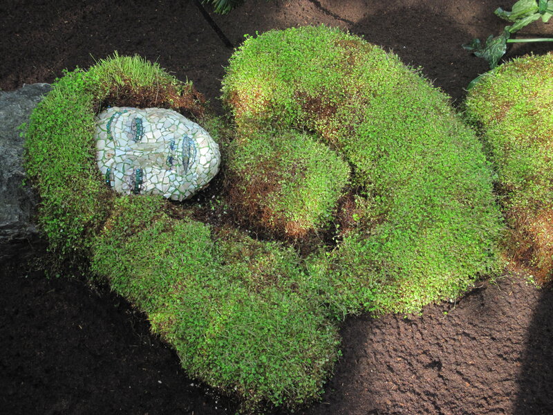 Mosaic Face in Moss