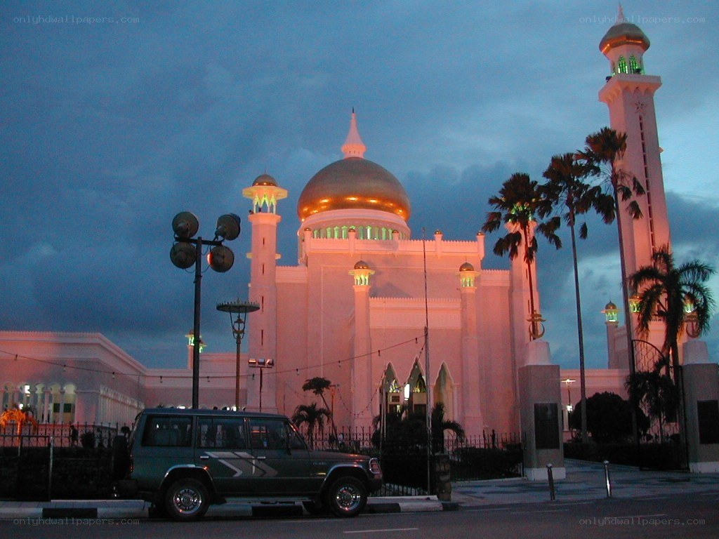 mosque at dusk with golden dome