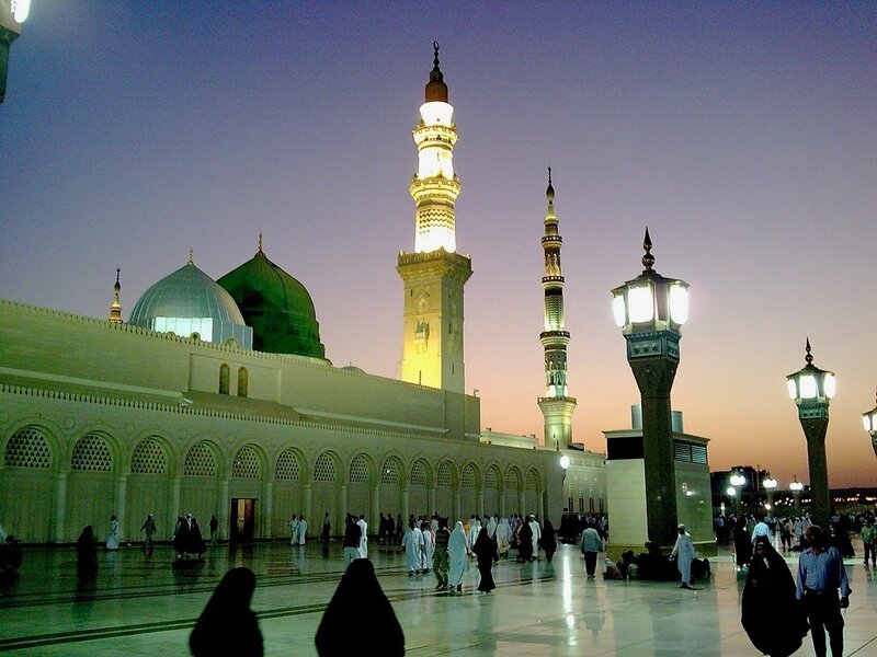 Mosque at dusk with green dome