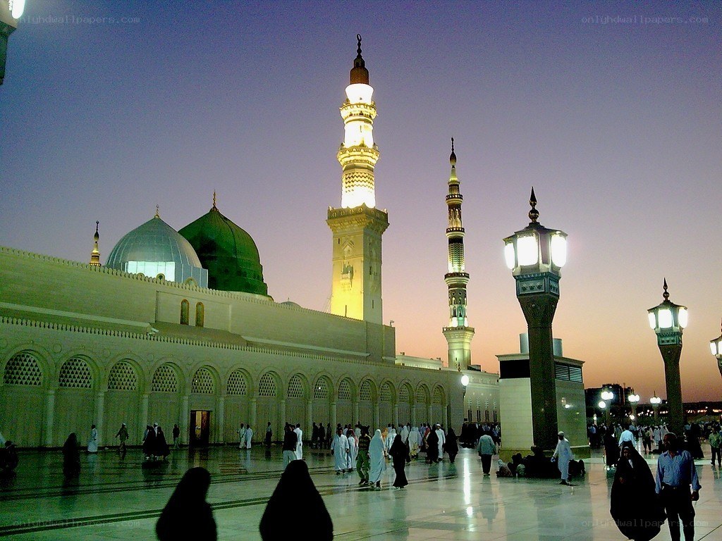 Mosque at dusk with green dome
