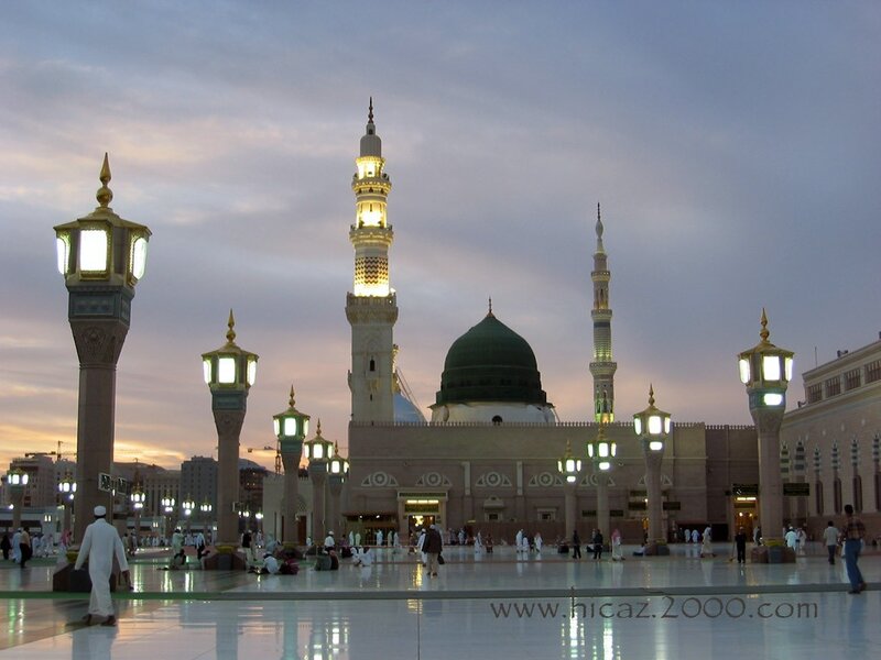 Mosque at dusk with green dome