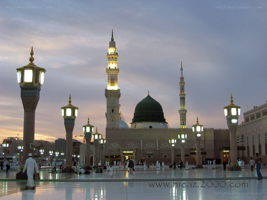 Mosque at dusk with green dome