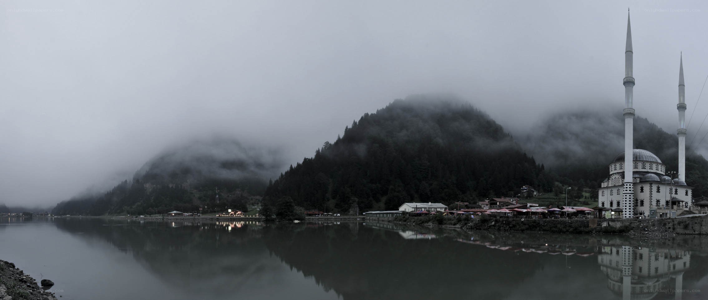 Mosque by the lake in fog