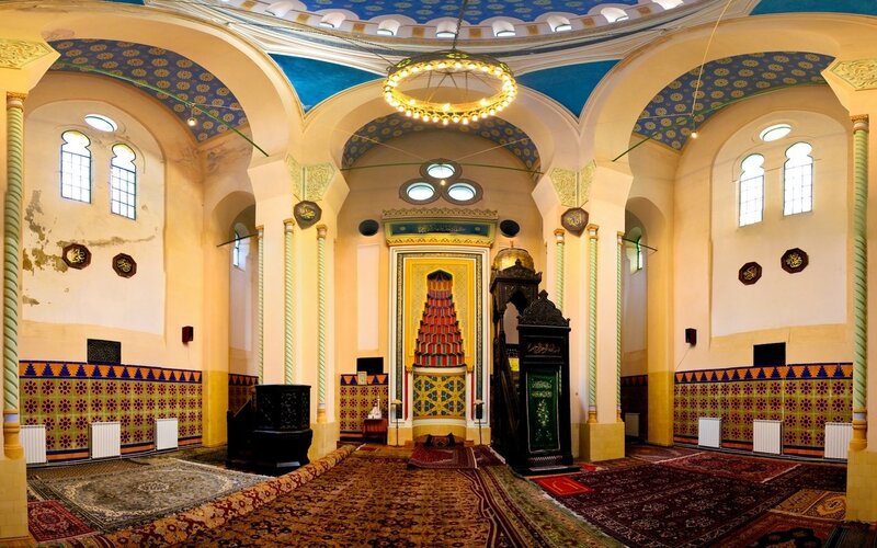 mosque interior with ornate ceiling