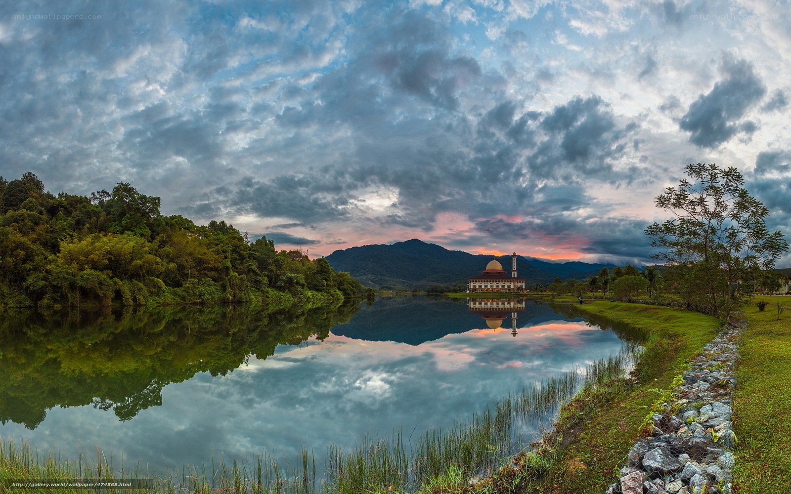 Mosque reflected in a lake at sunset