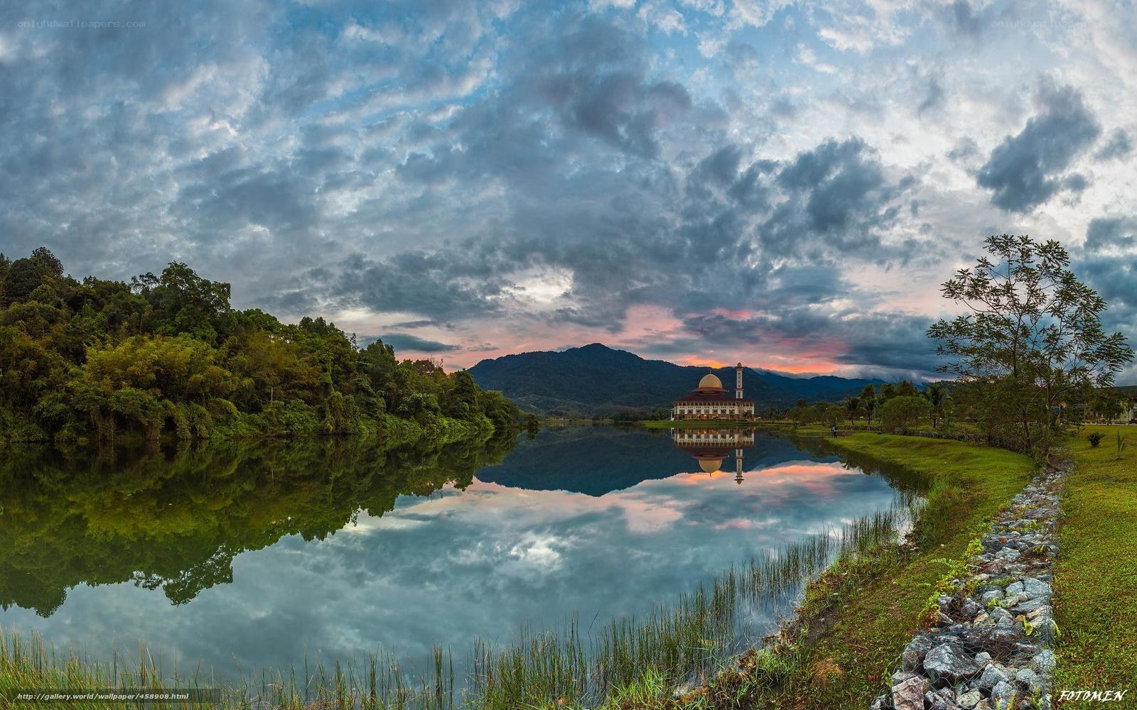 Mosque reflected in a lake at sunset