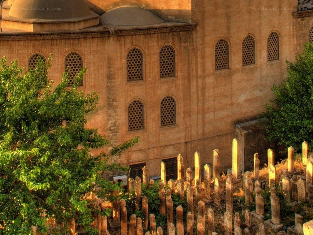 Mosque with cemetery at sunset