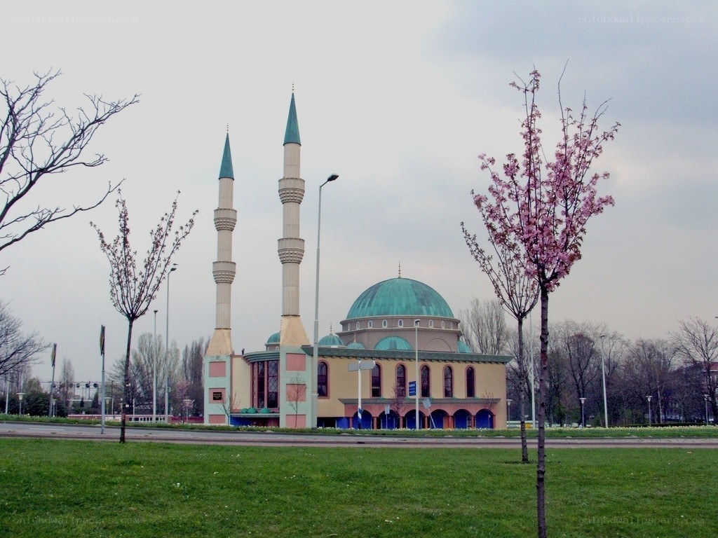Mosque with green domes and minarets