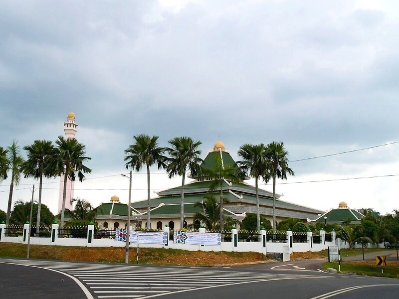 mosque with green roof and minaret