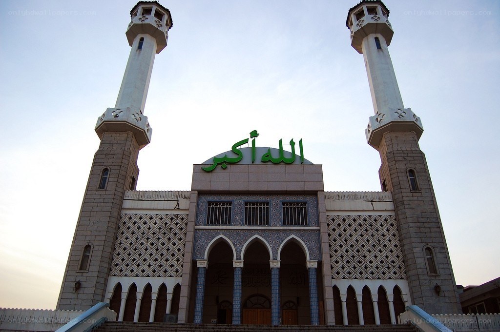 Mosque with green sign