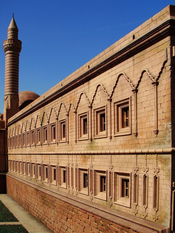 mosque with minaret and arched windows