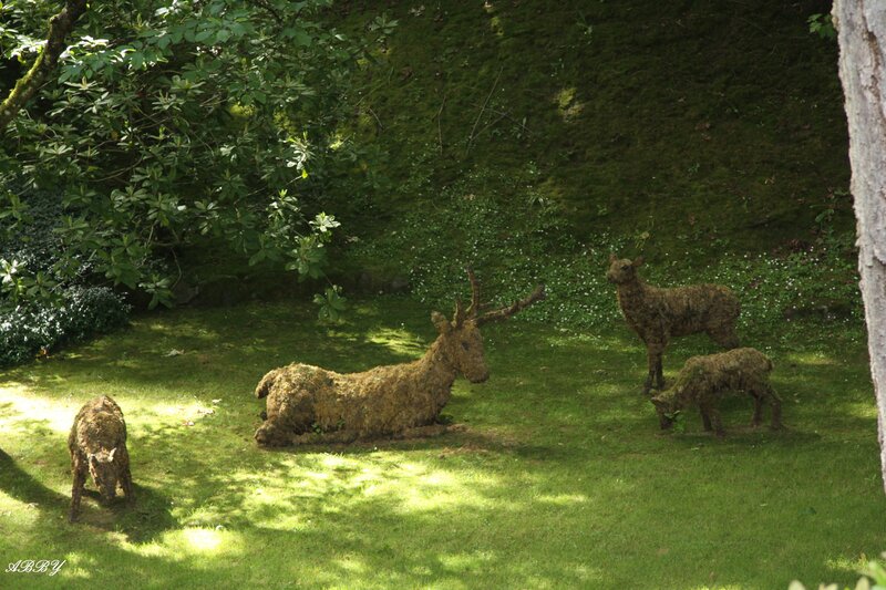 Moss-covered Deer Sculptures