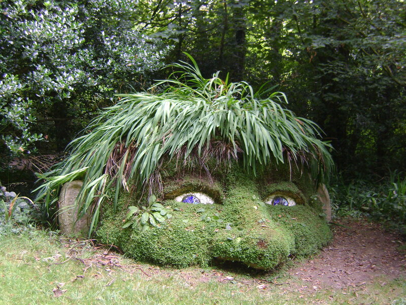 Moss-covered Face Sculpture