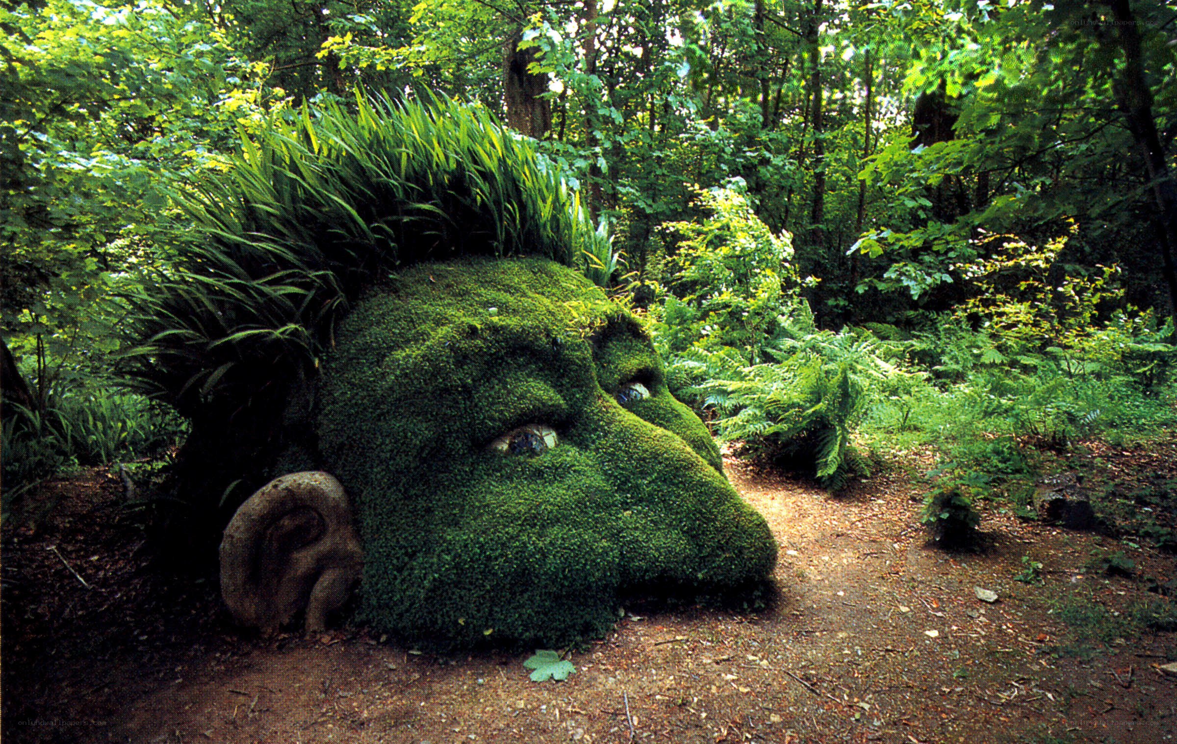 moss-covered head sculpture