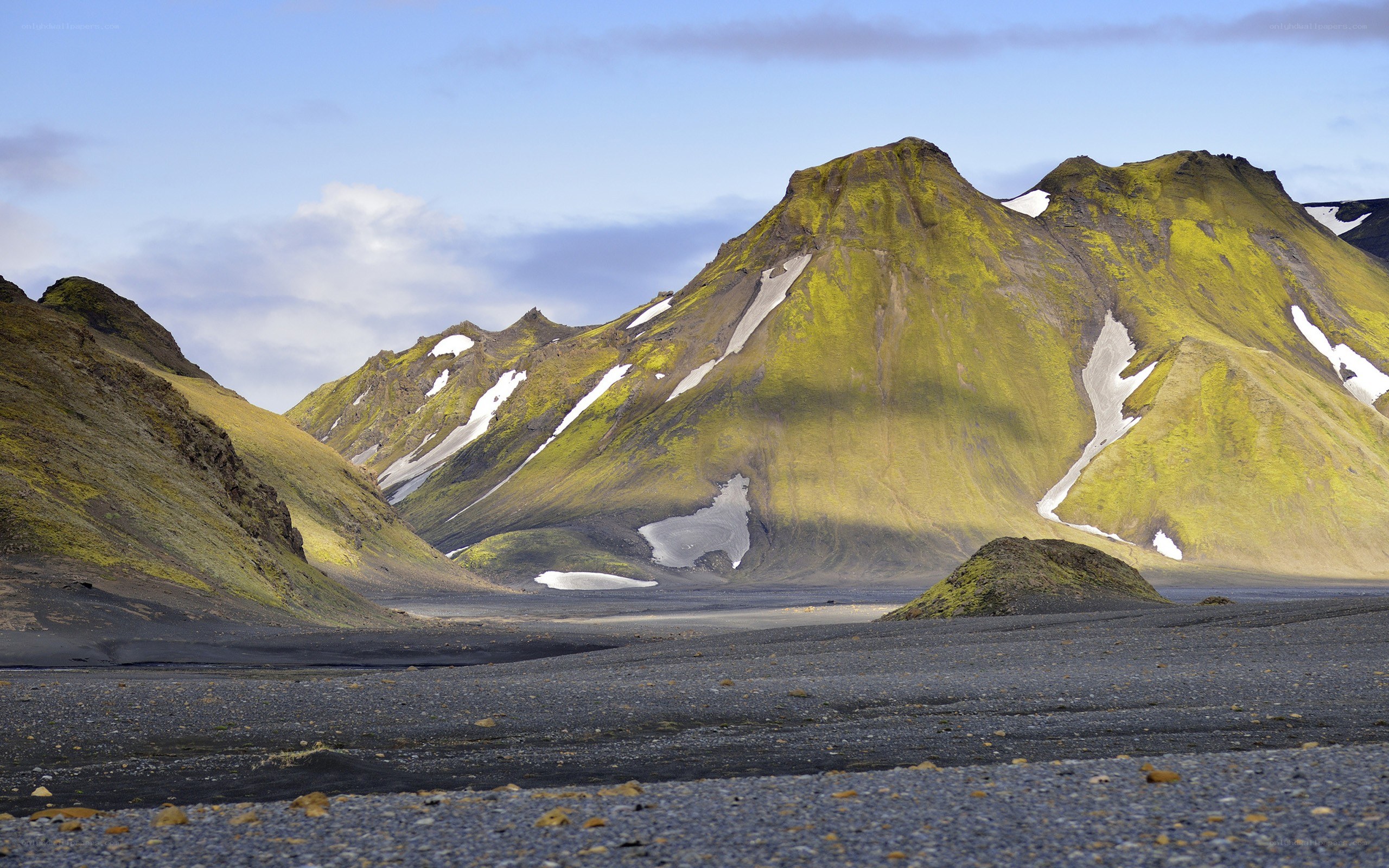 Moss-covered mountains with snow