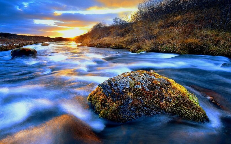 Moss-covered Rock in River — Blue