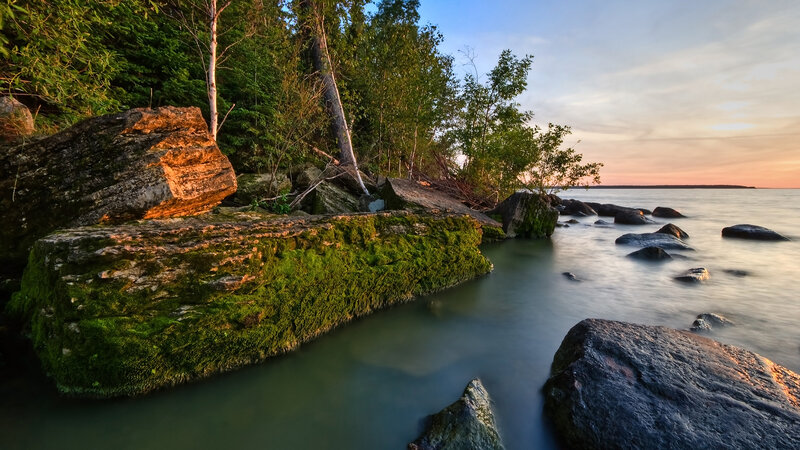 Moss-covered Rocks at Lake Shore